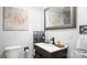 Modern bathroom showcasing a sleek vanity, stylish mirror, and a contemporary sink with a black faucet at 318 Lake Montonia Rd, Kings Mountain, NC 28086