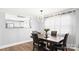 A dining area with a modern chandelier, and view to kitchen at 318 Lake Montonia Rd, Kings Mountain, NC 28086