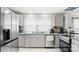 Bright kitchen with stainless steel appliances, granite counters and white cabinets at 318 Lake Montonia Rd, Kings Mountain, NC 28086