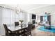 A living and dining area with modern decor, including an updated light fixture at 318 Lake Montonia Rd, Kings Mountain, NC 28086