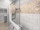 This bathroom features a glass enclosed shower with white subway tile and herringbone accent tile at 3489 Chagall Ct, Charlotte, NC 28205