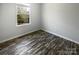 Bright bedroom featuring new floors and a window with a view of the neighborhood at 3489 Chagall Ct, Charlotte, NC 28205