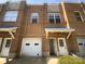 Charming brick townhome with attached garage and covered entryway at 3489 Chagall Ct, Charlotte, NC 28205
