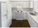 Bright kitchen featuring white appliances, stone countertops, and hardwood floors at 3489 Chagall Ct, Charlotte, NC 28205