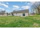 Backyard area featuring a lawn and view of the home at 413 E Henderson Es St, East Spencer, NC 28144
