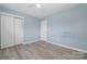 Empty bedroom with a ceiling fan, closet and light blue walls at 413 E Henderson Es St, East Spencer, NC 28144