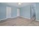 Spacious bedroom with two closets and light blue walls at 413 E Henderson Es St, East Spencer, NC 28144