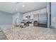 Modern kitchen featuring granite countertops, stainless steel appliances, and ample cabinet space at 413 E Henderson Es St, East Spencer, NC 28144