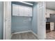 Compact laundry area with ample cabinet storage and washer hookups at 413 E Henderson Es St, East Spencer, NC 28144