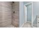Newly tiled shower with a rainfall shower head at 413 E Henderson Es St, East Spencer, NC 28144