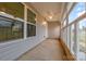 Spacious sunroom with ceiling fan provides a serene indoor-outdoor living experience at 413 E Henderson Es St, East Spencer, NC 28144
