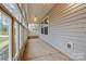 The sunroom features multiple windows and an overhead fan at 413 E Henderson Es St, East Spencer, NC 28144
