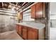 Basement kitchen with exposed pipes and concrete block walls at 431 Sullivan Rd, Statesville, NC 28677