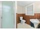 Bathroom with tiled floor, window, sink, and glass-doored shower at 431 Sullivan Rd, Statesville, NC 28677
