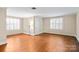 Bright bedroom with hardwood floors offers plenty of light from updated windows at 431 Sullivan Rd, Statesville, NC 28677
