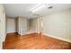 This large bonus room features wood floors and access to the second story landing at 431 Sullivan Rd, Statesville, NC 28677