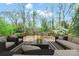 Staged outdoor deck with seating area and dining table overlooking the landscaped yard at 431 Sullivan Rd, Statesville, NC 28677
