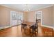 A formal dining room with hardwood floors and access to outdoor deck and additional rooms at 431 Sullivan Rd, Statesville, NC 28677