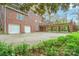 Brick home featuring a two-car garage, spacious deck, and covered outdoor area at 431 Sullivan Rd, Statesville, NC 28677