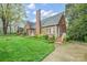 Attractive brick home with lush landscaping and a well-maintained lawn, showcasing classic charm at 431 Sullivan Rd, Statesville, NC 28677