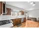An eat-in kitchen featuring stainless appliances, wooden cabinets, and hardwood flooring at 431 Sullivan Rd, Statesville, NC 28677