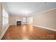Bright living room featuring hardwood floors, fireplace, and abundant natural light at 431 Sullivan Rd, Statesville, NC 28677