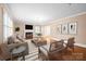 Bright living room showcasing hardwood floors, fireplace, and abundant natural light from shuttered windows at 431 Sullivan Rd, Statesville, NC 28677