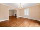 Spacious living room with hardwood floors, a fireplace, and elegant chandelier at 431 Sullivan Rd, Statesville, NC 28677