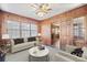 Cozy living room featuring wood paneled walls, ample natural light, and stylish furnishings at 431 Sullivan Rd, Statesville, NC 28677