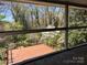 Enjoy outdoor living on this screened-in porch overlooking the backyard at 431 Sullivan Rd, Statesville, NC 28677