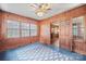 Charming sunroom with wood paneling and natural light, offering a serene and comfortable space to unwind at 431 Sullivan Rd, Statesville, NC 28677