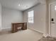 Bright foyer features wood-look floors and a modern front door, leading into an adjacent room with a wooden desk at 4503 Hunton Dale Nw Rd, Concord, NC 28027