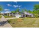 Charming single-story home featuring stone accents, a well-kept lawn, and a two car garage at 4503 Hunton Dale Nw Rd, Concord, NC 28027