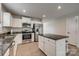 Stylish kitchen offers stainless steel appliances, granite countertops, and a center island with barstool seating at 4503 Hunton Dale Nw Rd, Concord, NC 28027
