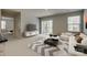 Cozy living room with sliding glass doors, a modern media console, and a comfortable white couch at 4503 Hunton Dale Nw Rd, Concord, NC 28027