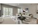 Inviting living room with a sliding glass door to the outside, a comfy white couch, and stylish decor at 4503 Hunton Dale Nw Rd, Concord, NC 28027