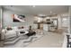 Open-concept living space with an island kitchen and a comfortable living area with modern decor at 4503 Hunton Dale Nw Rd, Concord, NC 28027