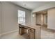 Cozy office space features a wooden desk, window with blinds, and neutral walls at 4503 Hunton Dale Nw Rd, Concord, NC 28027