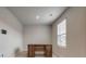 Well-lit office space with neutral walls, a window with blinds, and a classic wooden desk at 4503 Hunton Dale Nw Rd, Concord, NC 28027
