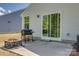 Outdoor patio with a grill, fire pit, and sliding glass door entry at 4503 Hunton Dale Nw Rd, Concord, NC 28027