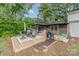 Outdoor deck with patio set, grill, rug, and gazebo, perfect for entertaining in a serene backyard setting at 511 Plymouth Ave, Salisbury, NC 28144