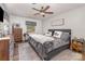 Inviting bedroom featuring a ceiling fan, window, shiplap accent wall, and Mr. & Mrs. pillows on the bed at 511 Plymouth Ave, Salisbury, NC 28144
