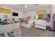 Playful ' bedroom featuring bright colors, a window, and a small television at 511 Plymouth Ave, Salisbury, NC 28144