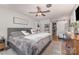 Spacious bedroom featuring a closet, ceiling fan, and Mr. & Mrs. pillows on the bed at 511 Plymouth Ave, Salisbury, NC 28144
