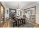 Elegant dining area with a large wooden table, fireplace, and comfortable seating for gatherings at 511 Plymouth Ave, Salisbury, NC 28144