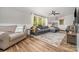 Bright and airy living room featuring hardwood floors, a comfortable sofa, and a large window at 511 Plymouth Ave, Salisbury, NC 28144