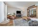 Relaxing living room with a fireplace, leather chair, and plush decor for cozy evenings at 511 Plymouth Ave, Salisbury, NC 28144