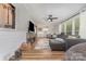 Cozy living room with a large sectional couch, hardwood floors, and natural light at 511 Plymouth Ave, Salisbury, NC 28144