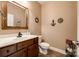 Well-lit powder room with modern vanity, tasteful decor, and practical layout at 5664 Norwood Ridge Dr, Rock Hill, SC 29732