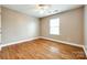 Empty bedroom with hardwood floors, a window and fresh paint at 5664 Norwood Ridge Dr, Rock Hill, SC 29732